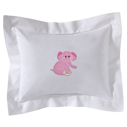 White pillow with pink embroidered elephant on a white background