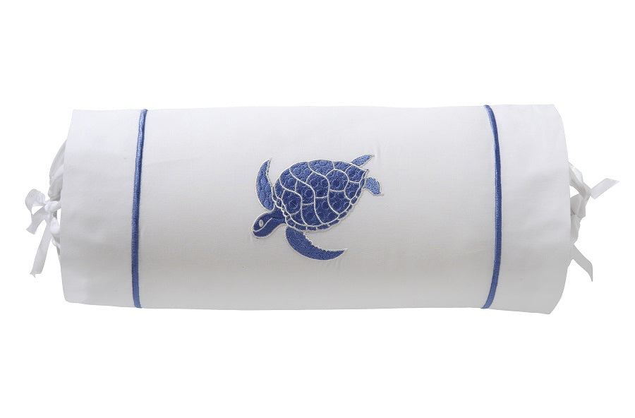 White cylindrical pillow with blue turtle design on a white background