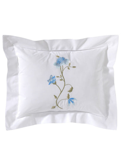 Embroidered floral design on a white pillowcase