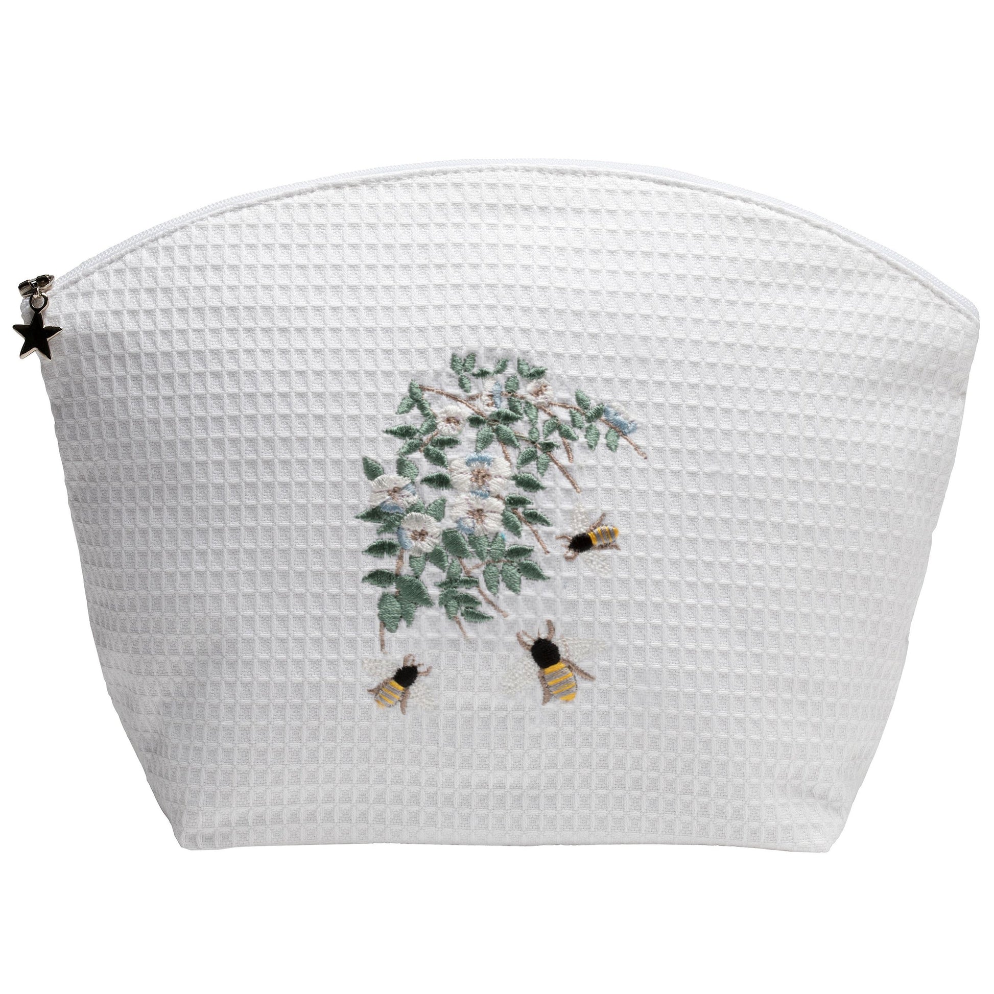 White textured pouch with floral and bee design on a white background
