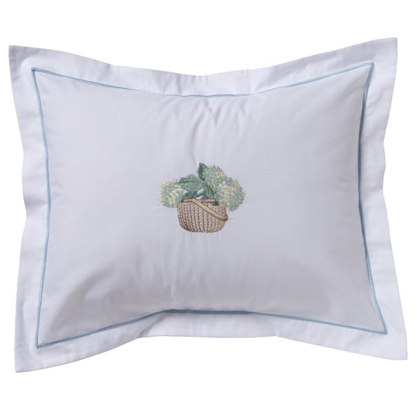 Decorative pillow with a basket of flowers design on a white background