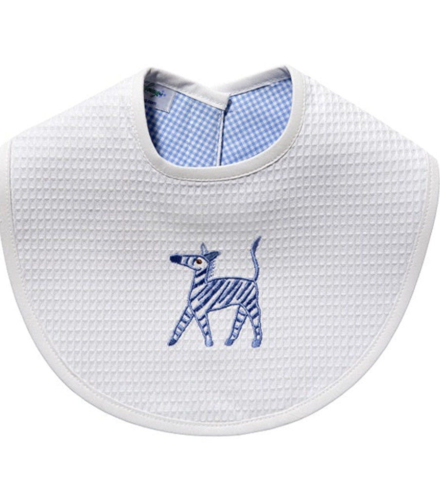 White bib with blue zebra design and checkered inner lining on a white background