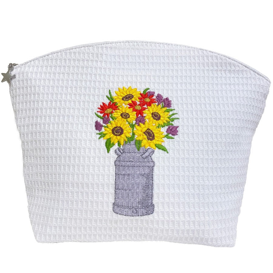 White textured pouch with embroidered flowers on a white background